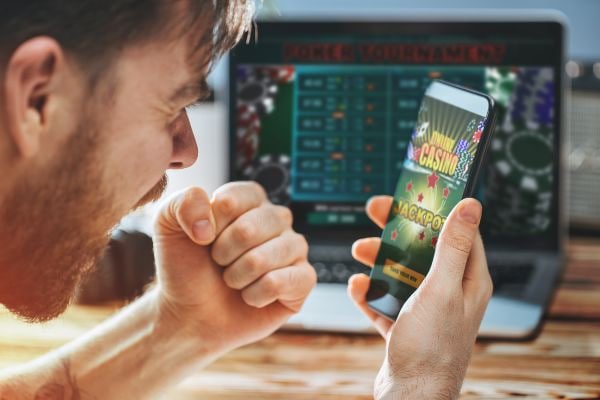 Filipino player browsing gamezone apk slot game library on smartphone